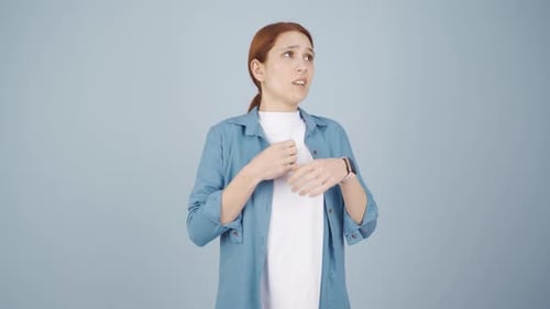 Woman Shivering, Rubbing Hands, Feeling Cold