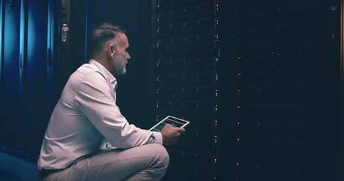 Man in data center with tablet, inspection or network maintenance with engineer in storage