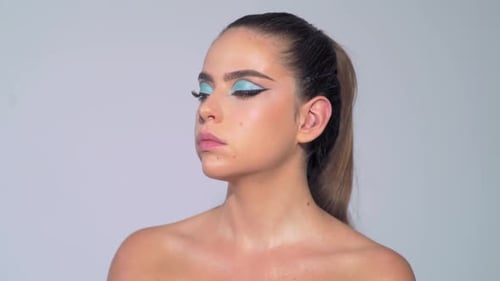 Makeup Artist Applies Makeup with Cosmetic Brush Beauty Visage Makeup Master with Young Beauty Model