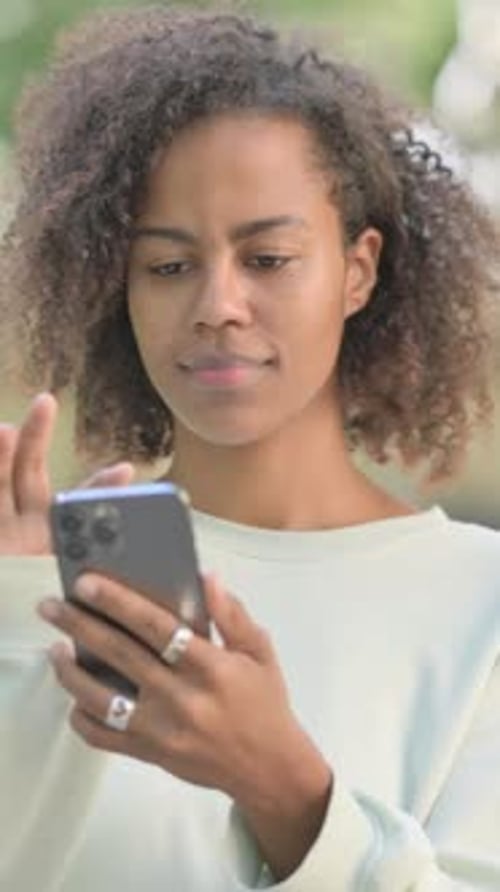 Woman Using Mobile Phone Outdoor
