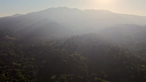 Sun Rises Beyond The Mountains And Woods