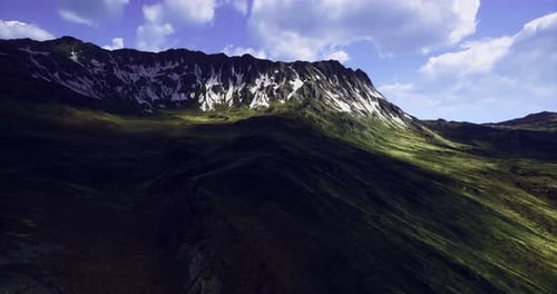 Majestic Mountain Landscape with Snow Capped Peaks Under Blue Sky