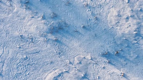 Aerial View of Snowy Icy Terrain in Winter Landscape