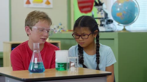 Children Enjoying Chemistry Experiment in Classroom