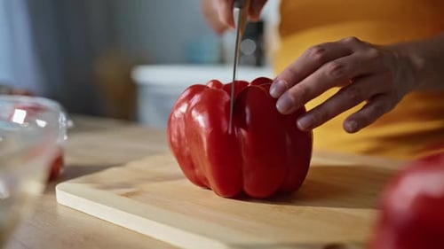Red Pepper Cut on Cutting Board in Kitchen