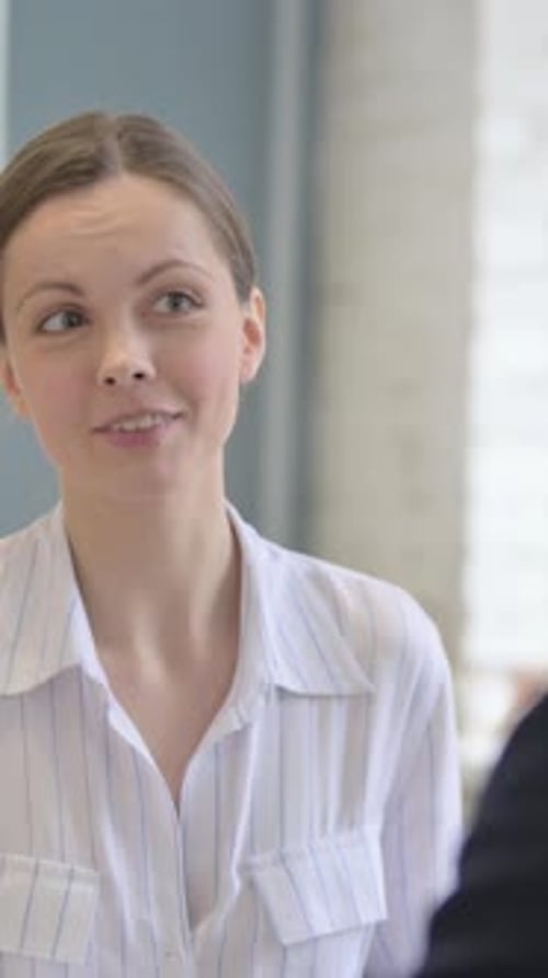 Close up of Woman Talking with Businessman, vertical video