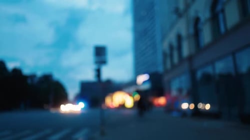 An Urban Nightscape Featuring Blurry City Lights Dynamic Architectural Elements and Lively