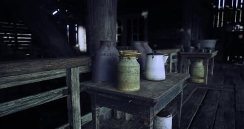 Rustic Barn Interior with Aged Farm Equipment and Milk Cans