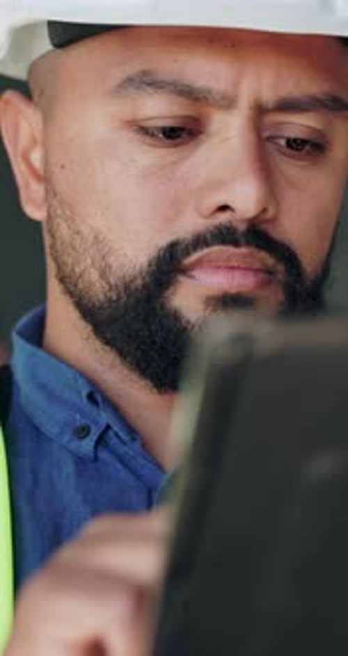 Tablet, man and construction worker on site with research for building, renovation or repairs