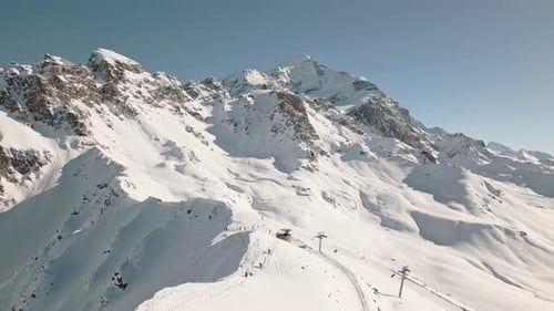 Skiers Go Up Hill For Freeriding