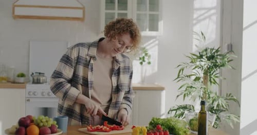 Woman Cutting Vegetables in Bright Sunny Kitchen