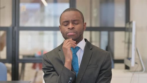 Young Man Having an Idea in Office