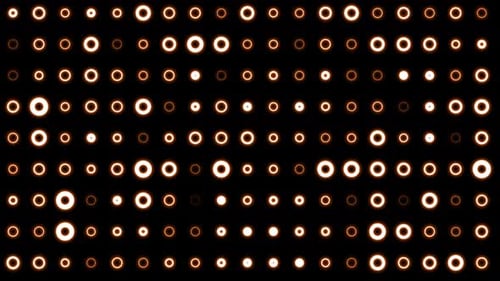 Abstract background of bright orange yellow glowing light bulbs from circles and dots of energy