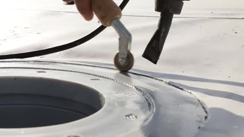 Sealing Vent on White Roof with Tools