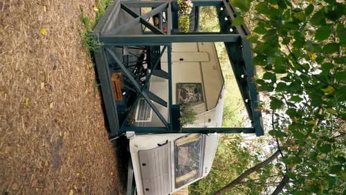 vertical video A mobile home with a terrace is located in country glamping site for relaxation