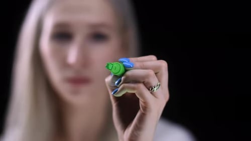 Sign of the National Avlyuta of Georgia The Girl Writes the Lari Sign with a Marker