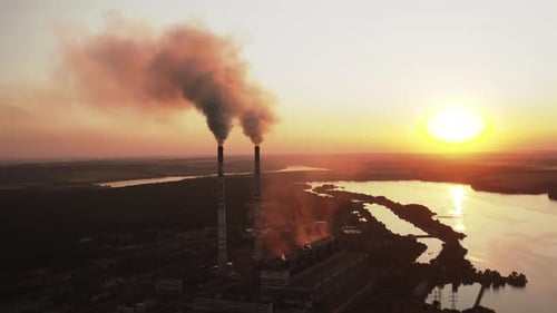 Static view of the power pylons on sunset time background.