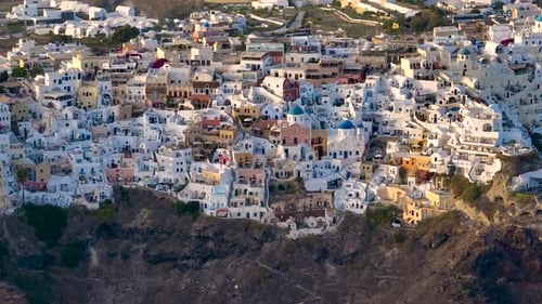 Aerial view of Oia's white buildings, Greece.