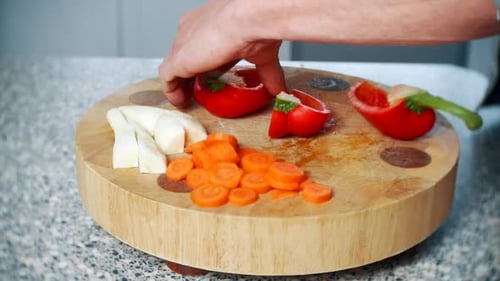 Vegetable Preparation: Red Pepper on Cutting Board