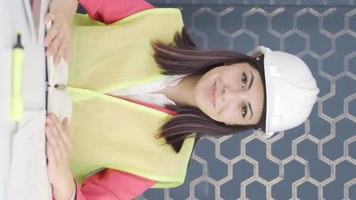 Vertical video of Excited woman engineer, impatient.