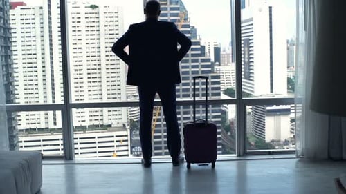 Businessman with Suitcase Admire View Standing by Window in Hotel Room 30s