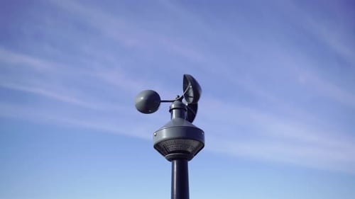 Anemometer Measuring Wind Speed against Blue Sky