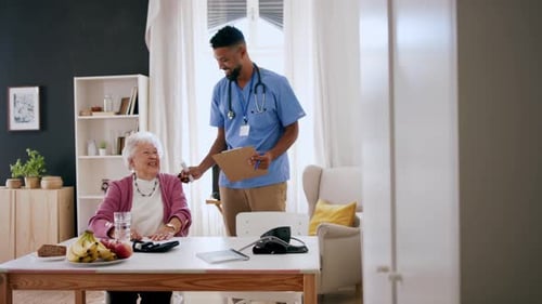 Senior Woman and Caregiver During Health Check
