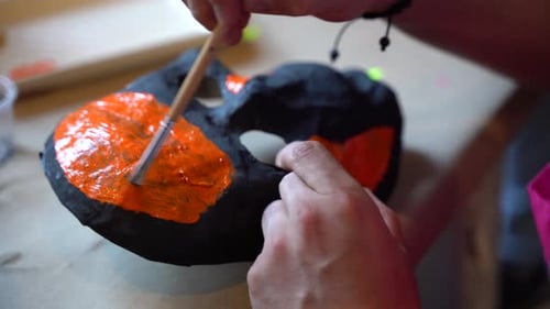 Painting a dead mask for the day of the dead celebration in Mexico