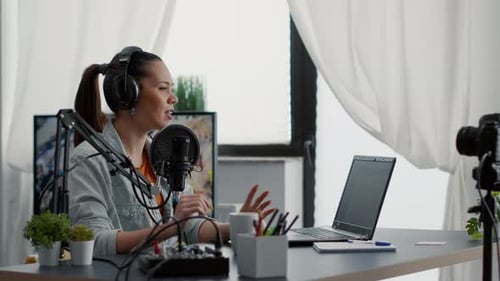 Young Woman Recording Podcast at Home