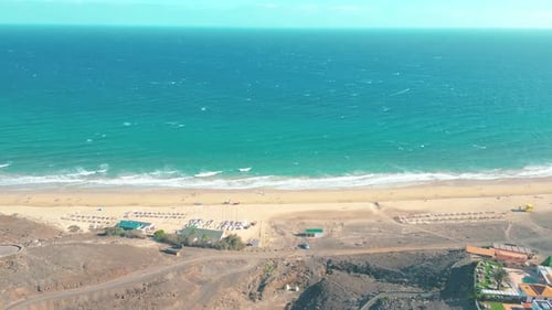 Amazing Esquinzo beach with endless horizon. Volcanic hills in the background and Atlantic Ocean. Es