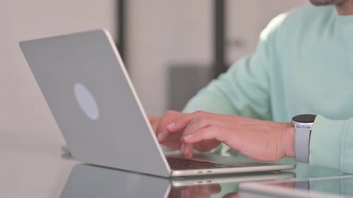 Close up of Man Typing on Laptop