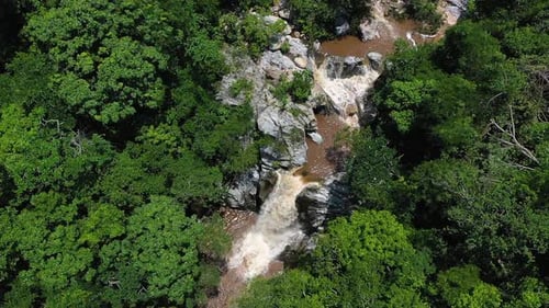 Aerial View of Cascading Tropical Waterfall