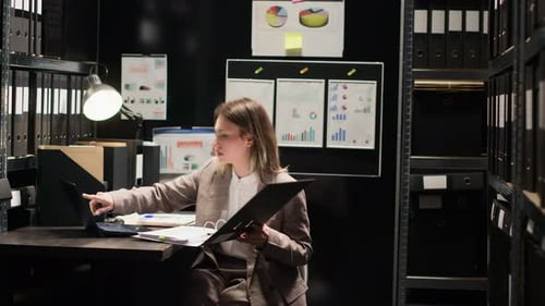 Investigator Enters Office with Folder