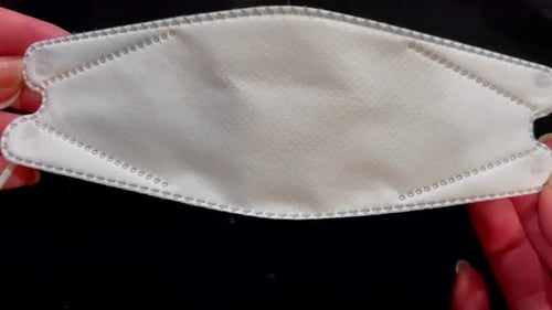 Close Up of Unused White Medical Mask