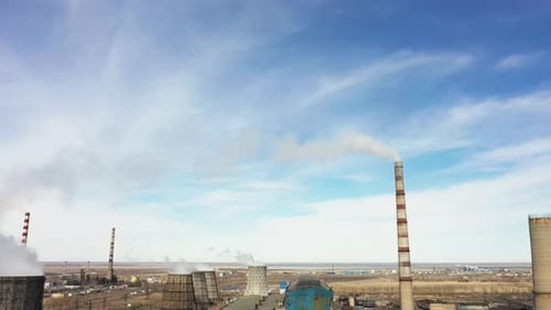 Aerial View of Thermal Power Plant Drone Flies Over Chimney Smoke Pipes and Cooling Towers of