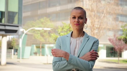 Confident Woman Stands in Business District