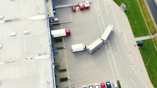 Aerial view of goods warehouse. Logistics center in industrial city zone from above. Aerial view of