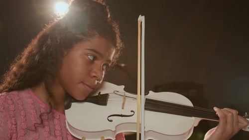 Close-up of Teenage Violinist Playing Instrument in Professional Music Studio