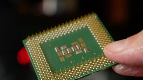 Close-up of a computer microprocessor in hands