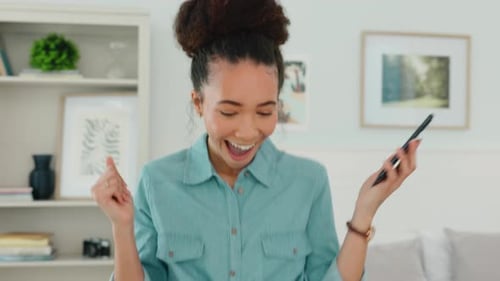 Excited Woman Celebrating Good News on Mobile Phone