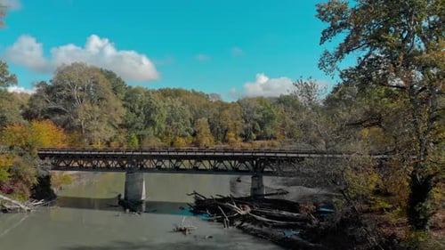 Aerial shot of a river and bridge in Georgia, Caucasus