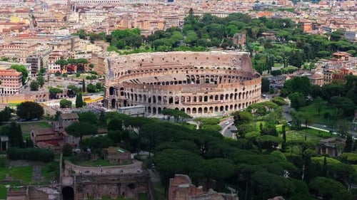 Drone Flying Away from the Colosseum in Rome, Italy. Flavian Amphitheatre