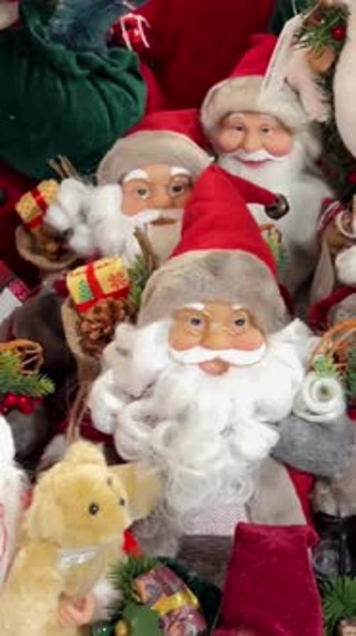 A Playful Stack of Santa Dolls and Decorations Captures Festive Cheer