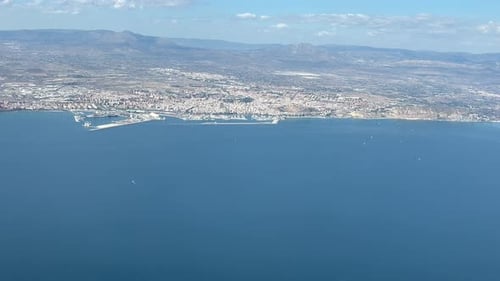 Aerial view of Alicante city, in SE Spain, in the coast of the Mediterranean Sea, shot from an airpl