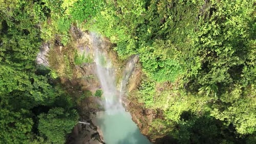 Bird's-eye view of Tumalog Falls, Oslob Cebu, drone rising