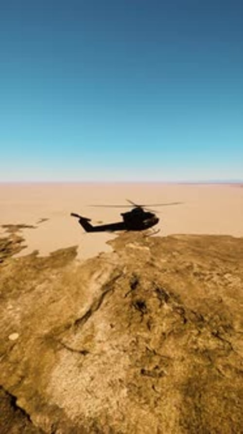 Vintage Military Helicopter Flying Over Desert