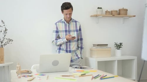 Using Smartphone While Standing in Office