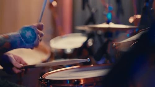 Closeup View of Drummer Hands with Drumsticks Playing Rock Music in Studio Contemporary Musical