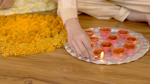 Lighting Diyas for Diwali Celebration