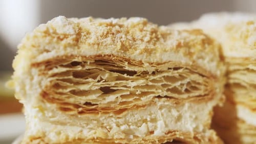Piece of Layered Cake on Plate Close Up Freshly Made Delicious Puff Pastry Cake